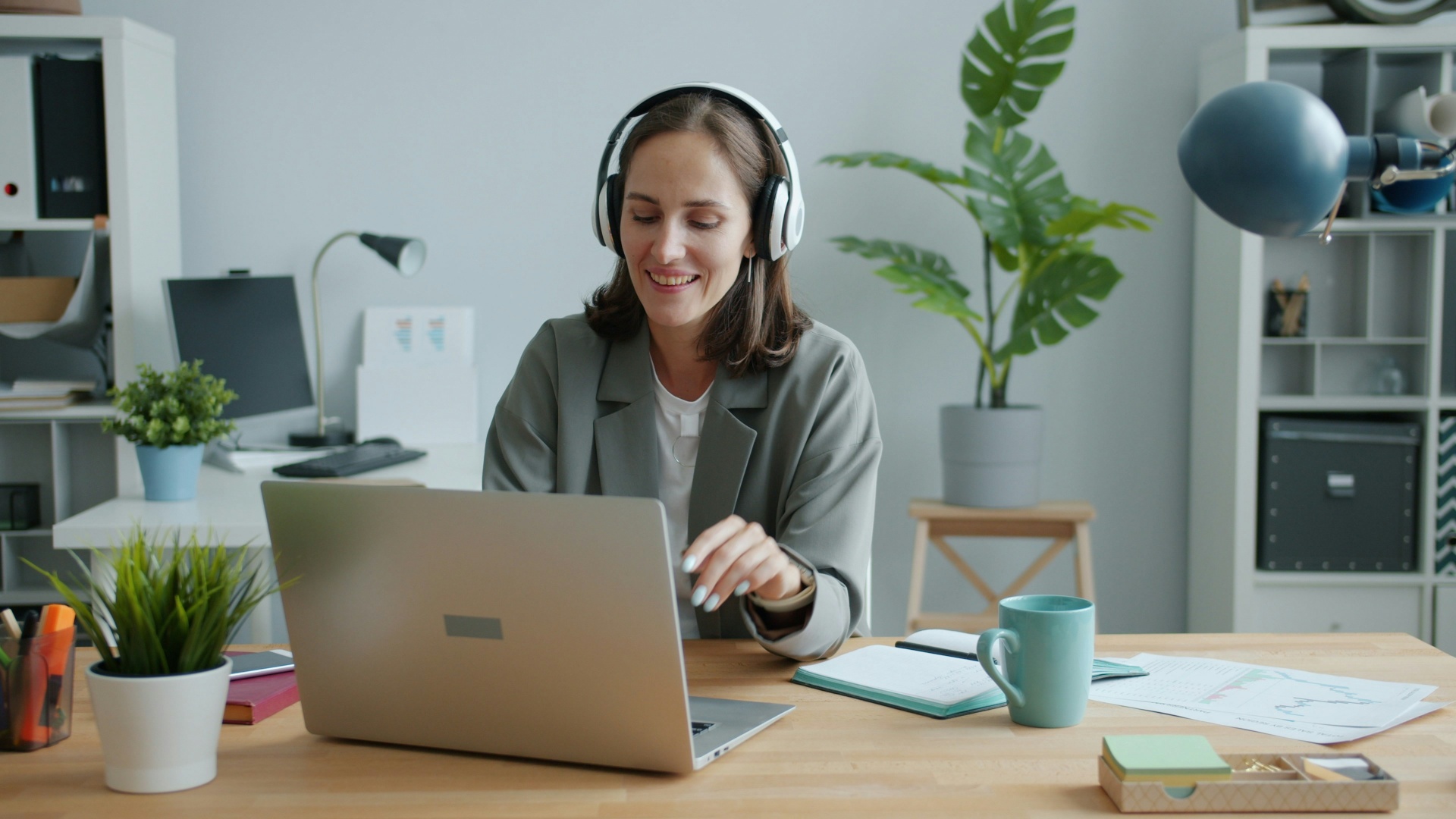 A focused remote professional working at her laptop